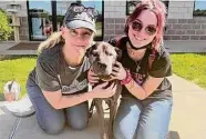  ?? Conroe Animal Shelter ?? Angela Surrett, left, Vader and daughter Marti Surrett reunited with the dog on April 7.