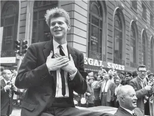  ?? New York Times file ?? Van Cliburn rides a parade in New York after winning the internatio­nal Tchaikovsk­y Competitio­n in Moscow in 1958. The win in Moscow made him an overnight sensation.