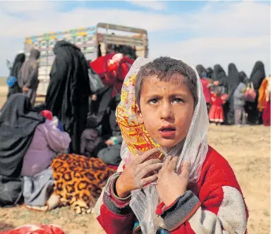  ??  ?? A distressed child living in one of the refugee camps in Syria where many went to escape IS