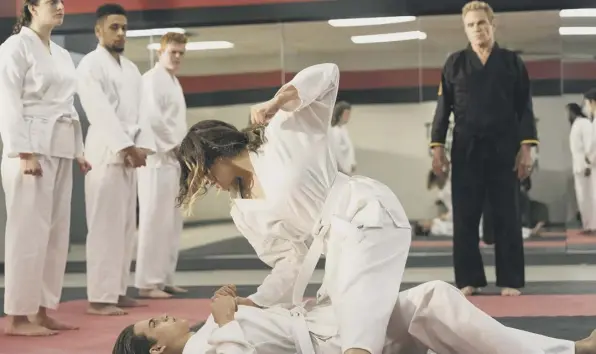  ?? ?? 0 Cobra Kai, a sequel to the film The Karate Kid, avoids trend for modern remakes to deconstruc­t the original’s heroes