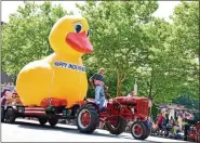  ?? MEDIANEWS GROUP FILE PHOTO ?? The Grand Marshal of this year’s Pottstown Fourth of July Parade was longtime Rotarian Henry Saylor, seen here in a previous year, using his tractor to pull the Rotary Club’s giant duck.