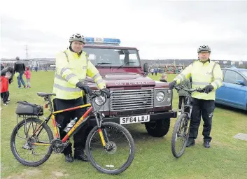  ??  ?? On their bikes Helping to curb wild fires