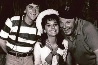  ?? Associated Press file photo ?? Dawn Wells is flanked by fellow cast members of “Gilligan’s Island,” Bob Denver, left, and Alan Hale Jr., in 1965. She died Wednesday in Los Angeles of causes related to COVID-19.