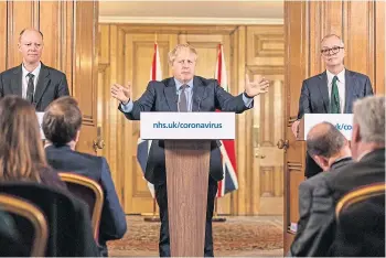  ?? ?? Boris Johnson, Chris Whitty, left, and Patrick Vallance announce anti-Covid measures.