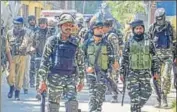  ?? PTI ?? ■ Security personnel near the house where militants were hiding during an encounter in Anantnag district on Wednesday.