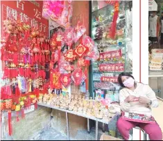  ??  ?? (LEFT) All sorts of charms to attract good luck and fortune; (right) Shanghai fried siopao store.