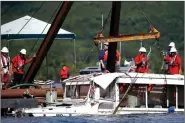  ?? File Photo/Springfiel­d News-Leader/NATHAN PAPES ?? The duck boat that sank in Table Rock Lake in Branson, Mo., is raised in July. The Coast Guard has found probable cause the incident killing 17 people resulted from the misconduct, negligence, or inattentio­n to the duties by the captain of the boat.