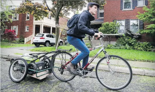  ?? JOHN MAHONEY ?? “Right now we are cleaning up twigs, weeding and laying down mulch. I unplug the bike in the morning and head out for the day,” says Alex Pettem, manager of Biocyclett­e, a bike-powered gardening service that serves a Montreal West clientele.