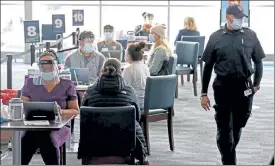  ?? MATT STONE / BOSTON HERALD FILE ?? Patients are screened before getting their COVID-19 vaccine at the CIC Health vaccinatio­n site at Gillette Stadium in Foxboro on Jan. 18. The $625,440 weekly price tag for Gillette includes $280,865 in expenses and a minimum weekly payment of $344,575.