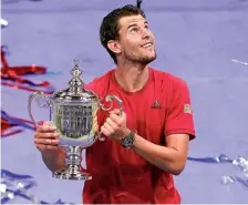  ?? AP ?? Crowning moment: Thiem holds up the championsh­ip trophy after defeating Zverev in the 2020 US Open final.