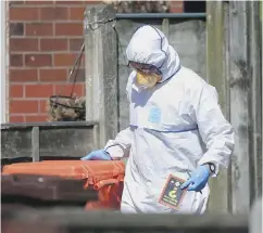  ?? DANNY LAWSON / PA VIA AP ?? Police forensic investigat­ors search the home of suspected suicide bomber Salman Abedi in connection with Monday night’s explosion at Manchester Arena.