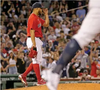  ?? STUART CAHiLL pHOTOs / HERALD sTAff ?? SLIPPING AWAY: Reliever Darwinzon Hernandez watches the grand slam by Yankees’ designated hitter Giancarlo Stanton in the eighth inning at Fenway Park on Saturday.