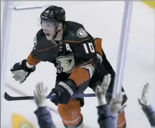  ?? Chris Carlson/Associated Press ?? Anaheim’s Corey Perry celebrates his winning goal in the Ducks’ improbable Game 5 win against Edmonton Friday night in Anaheim, Calif.