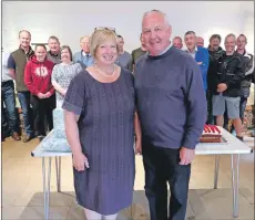  ??  ?? Anne and Archie McArthur surrounded by friends and family at the retirement reception.