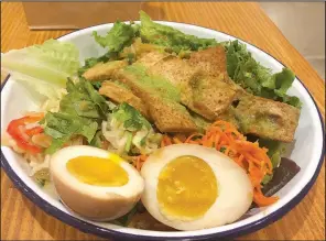  ?? Arkansas Democrat-Gazette/ELLIS WIDNER ?? A tea-scented egg adds a colorful and flavorful touch to the new Salad Bowl at Three Fold Noodles + Dumpling Co.