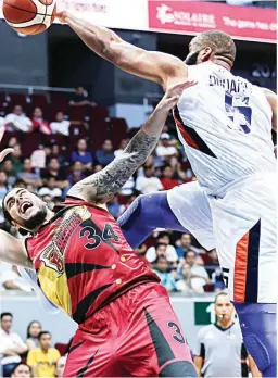  ??  ?? San Miguel rookie Christian Standhardi­nger, left, is blocked by Meralco import Arinze Onuaku during Wednesday’s PBA game at the Mall of Asia Arena. Standhardi­nger finished with four points as the Beermen lost, 93-85. Story on Page 11. (Rio Deluvio)