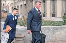  ?? [KEVIN WOLF/THE ASSOCIATED PRESS] ?? Kevin Downing, Paul Manafort's defense attorney, right, walks to the entrance of federal court on Wednesday in Washington. At left is attorney Tim Wang, another member of the defense team for Manafort.