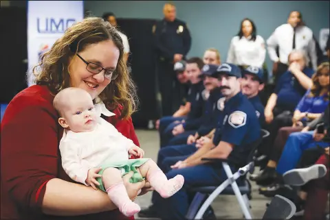  ?? PHOTOS BY WADE VANDERVORT ?? Jessica Spellacy holds her 4-month-old daughter, Johanna, on Tuesday at the UMC Trauma Center. Johanna’s life was saved Feb. 7 when Las Vegas Fire & Rescue paramedics relieved constricti­on to her umbilical cord when she wasn’t getting enough oxygen during a breech birth. The Spellacy family visited University Medical Center to join in a celebratio­n with UMC’S labor and delivery team, infant ICU team members and the Las Vegas Fire & Rescue team that assisted them for the first time since Johanna was discharged after her touch-and-go birth.