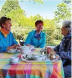  ?? ?? Pictured from left are Deidre Rautenbach and Cornelia de Koker having tea with a vulnerable resident.