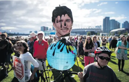  ?? DARRYL DYCK / THE CANADIAN PRESS ?? Prime Minister Justin Trudeau, the object of scorn at a protest against the Trans Mountain Pipeline expansion in Vancouver in May, has disappoint­ed progressiv­es who have now turned on him, writes Kelly McParland.