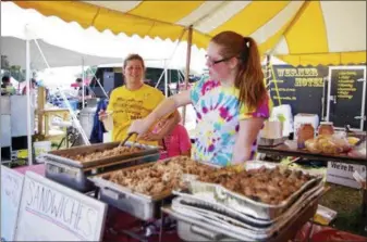  ?? SUBMITTED PHOTOS ?? Penn Werner Hotel servers from Wernersvil­le will serve up BBQ favorites the PA BBQ Fest at the Leesport Farmers Market on July 7 and 8.