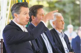  ?? Rich Pedroncell­i / Associated Press ?? Gov. Gavin Newsom was joined by Rep. John Garamendi, DWalnut Grove, and Rep. Tom McClintock, RElk Grove, among other officials, at a summit in South Lake Tahoe.