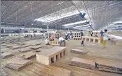  ??  ?? Cardboard beds being assembled in the 10,000-bed Radha Soami Satsang Beas campus in Delhi’s Chhatarpur. AJAY AGGARWAL /HT