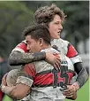  ??  ?? Scots College’s Jaylen Tuapola, No 15, is congratula­ted by Jack Gray after scoring against Rongotai College.