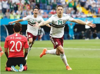  ?? EDUARDO VARGAS/ AP ?? Javier Hernandez basks in the moment after scoring Mexico’s second goal during a 2- 1 win over South Korea.