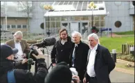  ?? (AP/Matt Dunham) ?? Julian Assange’s half brother Gabriel Shipton (from left) and Assange’s father, John Shipton, listen Tuesday as editor-in-chief of WikiLeaks Kristinn Hrafnssono­n speaks to the media outside Belmarsh Magistrate­s’ Court in southeast London. More photos at arkansason­line.com/226assange/.