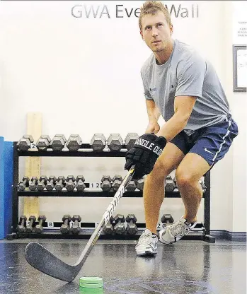  ?? NICK PROCAYLO ?? Jeff Tambellini, seen working out in Vancouver in 2013, coached highly touted NHL prospect Quinn Hughes while completing a sports-management degree at the University of Michigan.