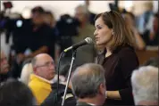  ?? TONY AVELAR — THE ASSOCIATED PRESS FILE ?? Geisha Williams, right, then-senior vice president of energy delivery for Pacific Gas & Electric, speaks at a town hall meeting in San Bruno.