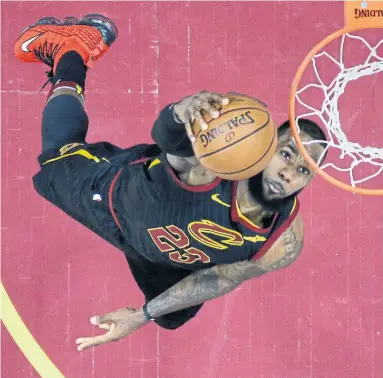  ?? TONY DEJAK/THE ASSOCIATED PRESS ?? LeBron James goes up for two of 38 points in Saturday night’s Game 3 win by the Cavs. The Raptors rallied from a 15-point halftime deficit to tie with seconds to go — when LeBron drove the length of the court for the winning bucket.