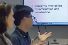  ?? Christian Snyder/Post-Gazette ?? Joshua Uyheng, center, discusses his research in September during a meeting of a group working to reduce online hate speech at Carnegie Mellon University’s Center for Informed Democracy and Social Cyber Security.