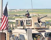  ?? [HUSSEIN MALLA/THE ASSOCIATED PRESS] ?? A U.S. soldier sits in an armored vehicle on a road leading to the tense front line with Turkish-backed fighters Wednesday in Manbij, north Syria.