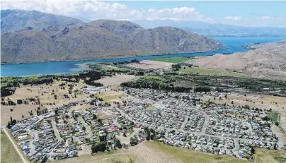  ?? PHOTO: STEPHEN JAQUIERY ?? Basking in the North Otago sun . . . Campers flock to holiday spots across North Otago such as Otematata (pictured) in summer, with caravans and boats in tow, to enjoy water sports, swimming, cycling and walking. You’ll see many boats and jet skis out on the lakes towing waterskier­s or inflatable­s or fishing for trout.