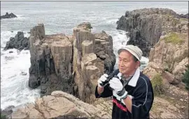  ?? Jonathan Kaiman Los Angeles Times ?? “THESE people are asking for help. They’re just waiting for someone to speak with them,” says Yukio Shige, who patrols Japan’s Tojinbo cliffs nearly every day.