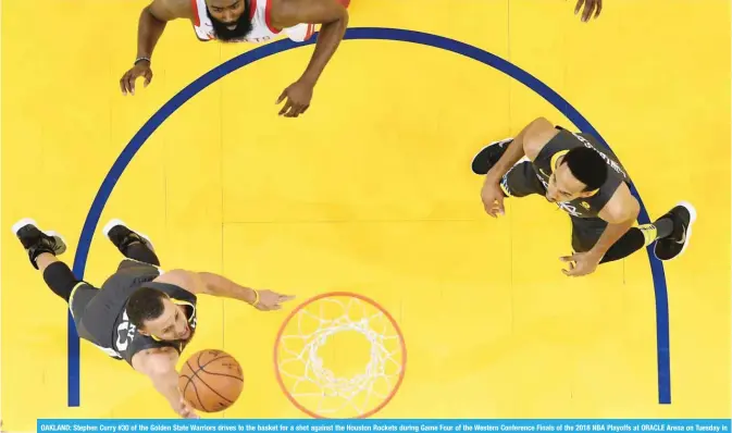  ??  ?? OAKLAND: Stephen Curry #30 of the Golden State Warriors drives to the basket for a shot against the Houston Rockets during Game Four of the Western Conference Finals of the 2018 NBA Playoffs at ORACLE Arena on Tuesday in Oakland, California. — AFP