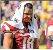  ?? Arkansas Democrat-Gazette/BENJAMIN KRAIN ?? Arkansas tight end Jeremy Patton walks off the field Saturday after the Razorbacks fell to the LSU Tigers in Baton Rouge.