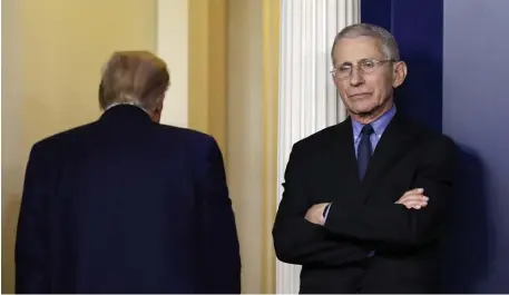  ?? Tns file ?? ABOUT-FACE: President Trump turns his back to Dr. Anthony Fauci during a coronaviru­s task force briefing in March.