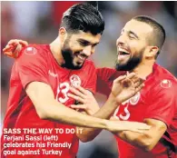  ??  ?? SASS THE WAY TO DO IT Ferjani Sassi (left) celebrates his Friendly goal against Turkey