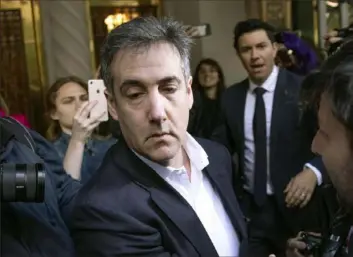  ?? Kevin Hagen/Associated Press ?? Michael Cohen, former attorney to President Donald Trump, leaves his apartment building May 6 before beginning his prison term in New York.