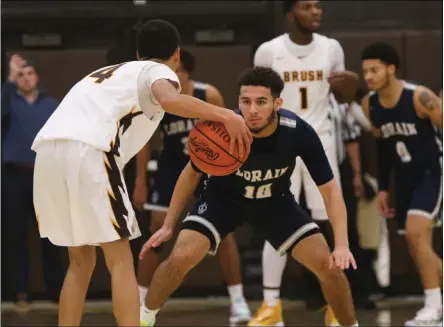  ?? DAVID C. TURBEN — FOR THE NEWS-HERALD ?? Lorain, shown in a boys basketball game against Brush on Dec. 3, 2019, announced Nov. 20 it was pausing winter sports after a spike in coronaviru­s numbers in the county.