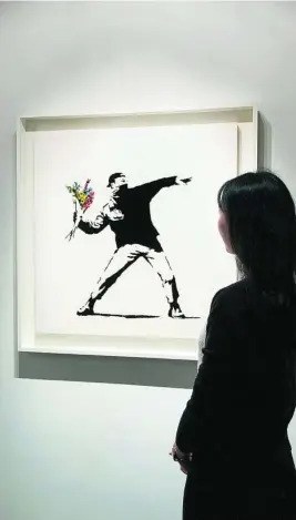  ?? SOTHEBY’S ?? La obra de Banksy subastada y adjudicada en criptomone­das