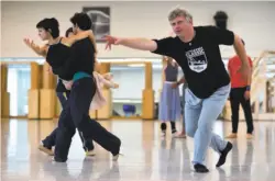  ??  ?? Resident choreograp­her Yuri Possokhov rehearses dancers for the premiere of his “Optimistic Tragedy.”