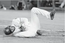  ?? Tony Gutierrez / Associated Press ?? Elvis Andrus is on the DL for the first time after his right elbow was broken by a pitch from the Angels' Keynan Middleton.