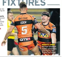  ??  ?? MIGHTY MIKE Michael Shenton (right) celebrates scoring try for Tigers last night