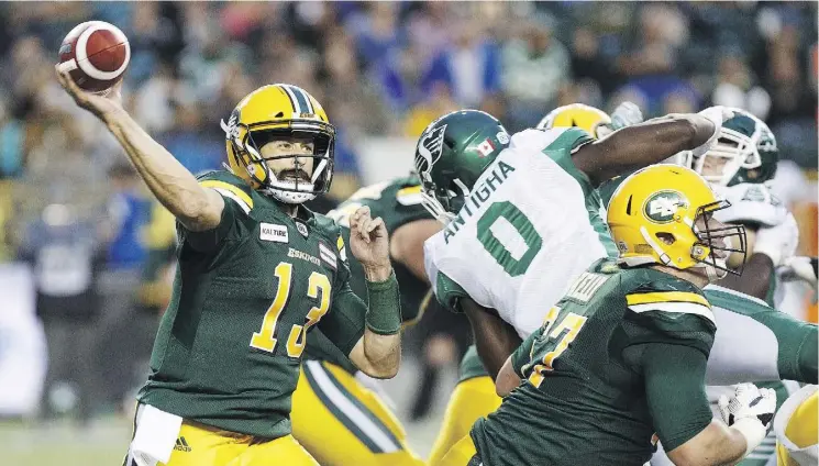 ?? CODIE MCLACHLAN ?? Eskimos quarterbac­k Mike Reilly prepares to air it out against the visiting Saskatchew­an Roughrider­s in the first half Thursday night. The Esks won the matchup 26-19.