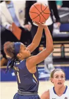  ?? BENNY SIEU / USA TODAY SPORTS ?? Marquette Golden Eagles guard Danielle King takes a shot against Creighton.