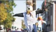  ?? Brian A. Pounds / Hearst Connecticu­t Media ?? Scarecrows decorate every lightpole for the Downtown Milford Associatio­n's first annual scarecrow fest on Broad Street in Milford on Tuesday.